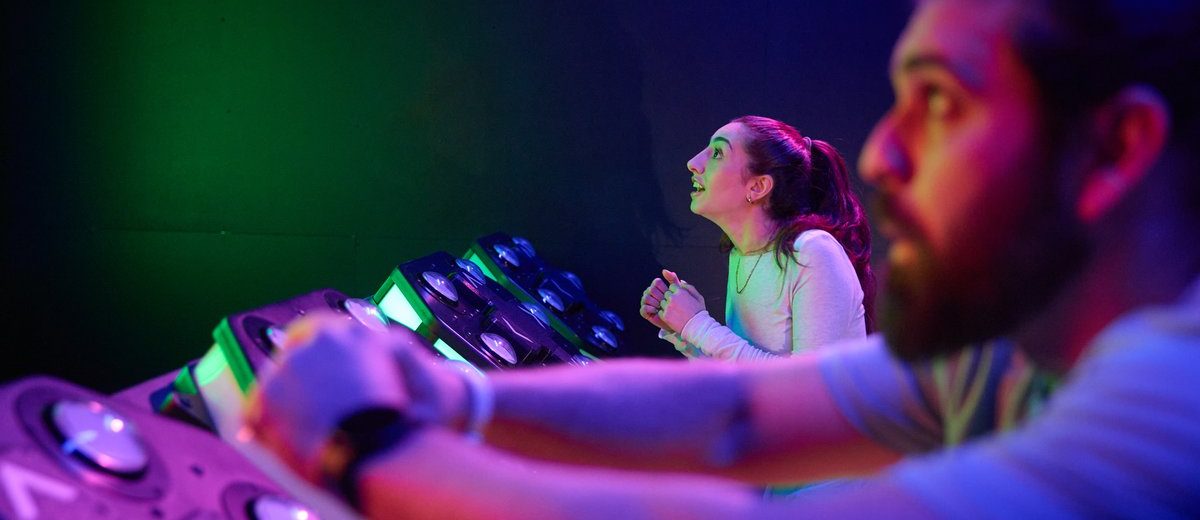 Two players celebrating inside an Activate game room